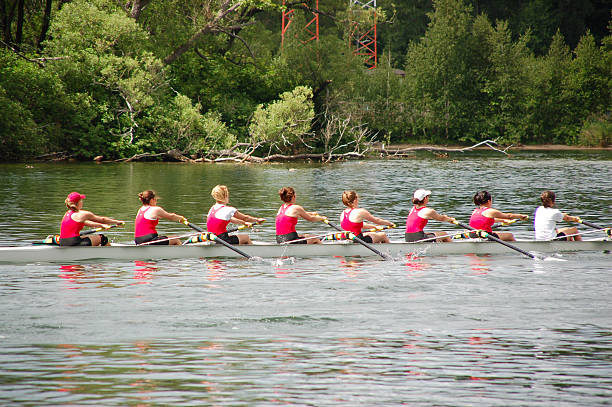 Female rowing team competing in a race.